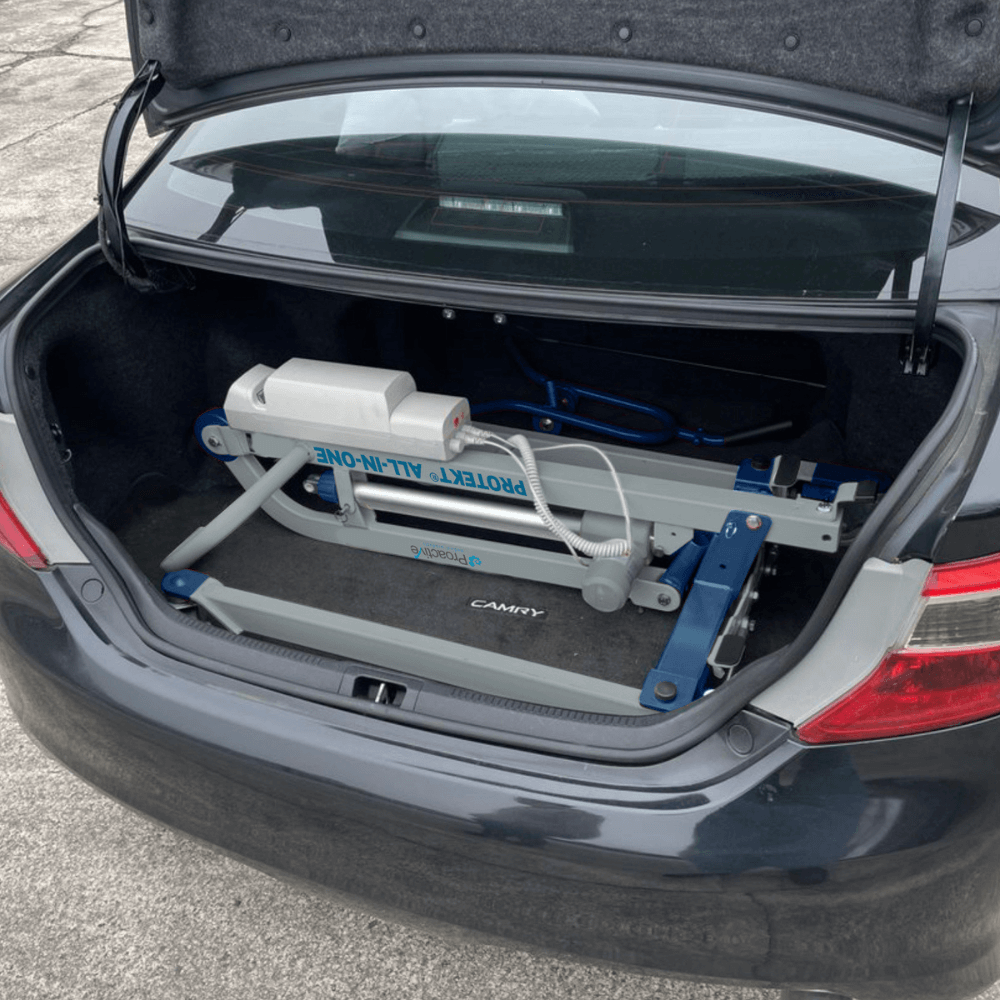 Proactive Medical Protekt All-In-One Folding Car Transfer Electric Patient Lift (350 lbs. Capacity) Folded Device in the trunk of a car